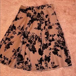 Beautiful pink skirt with black floral accents